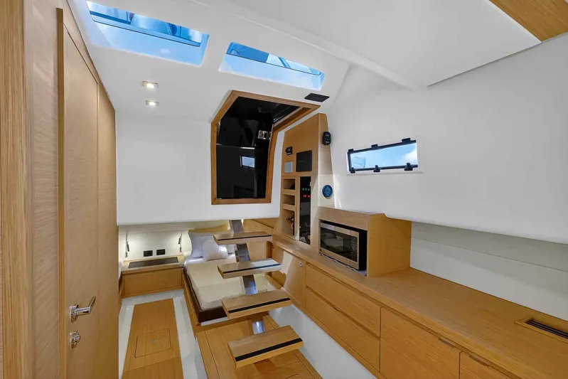 Seaduction Yacht Photos Pics Luxurious interior of 2023 Pardo Yachts 43, featuring modern wood finishes and skylights.