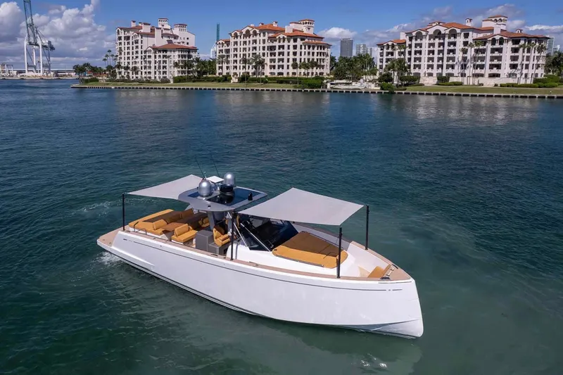 Seaduction Yacht Photos Pics 2023 Pardo Yachts 43 cruising near luxury waterfront apartments.