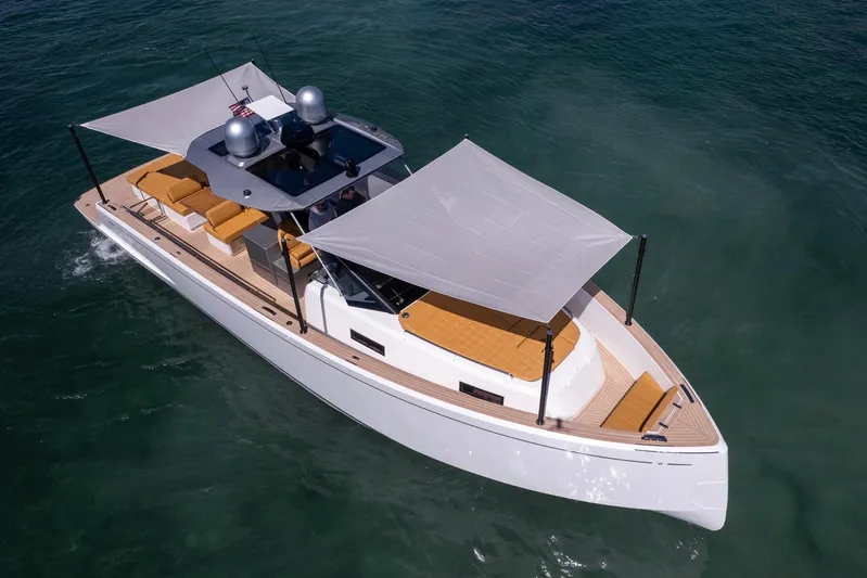Seaduction Yacht Photos Pics 2023 Pardo Yachts 43 cruising on clear water, featuring sleek design and sunshade.