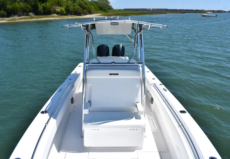  Yacht Photos Pics 2024 Contender 28 Tournament boat on calm water, featuring sleek design and dual engines.