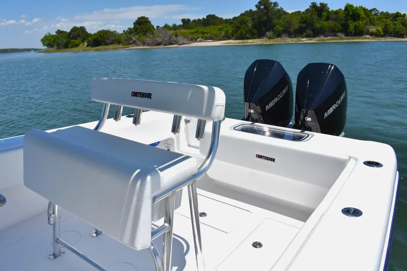  Yacht Photos Pics 2024 Contender 28 Tournament boat with dual Mercury engines on a serene water backdrop.