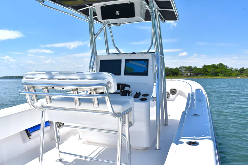  Yacht Photos Pics 2024 Contender 28 Tournament boat on water, featuring sleek design and modern navigation equipment.