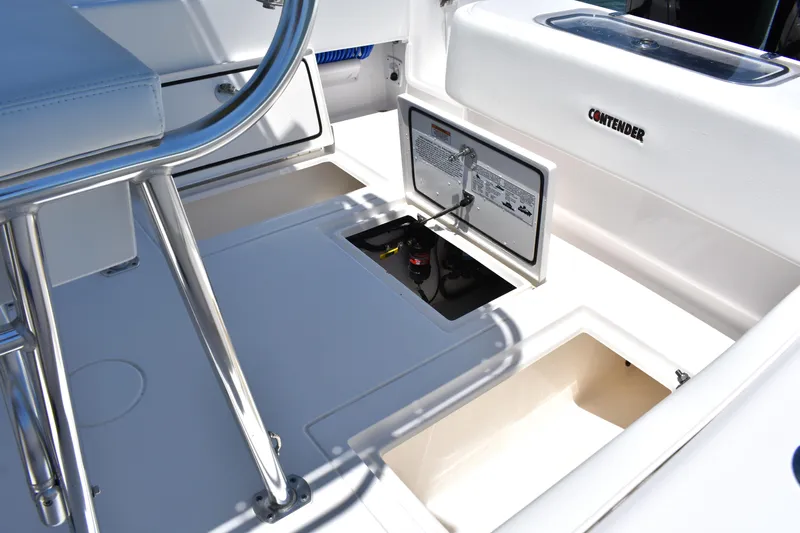 Yacht Photos Pics 2024 Contender 28 Tournament boat interior with open storage compartments and seating.
