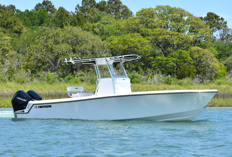  Yacht Photos Pics 2024 Contender 28 Tournament boat on water, featuring sleek design and dual engines.