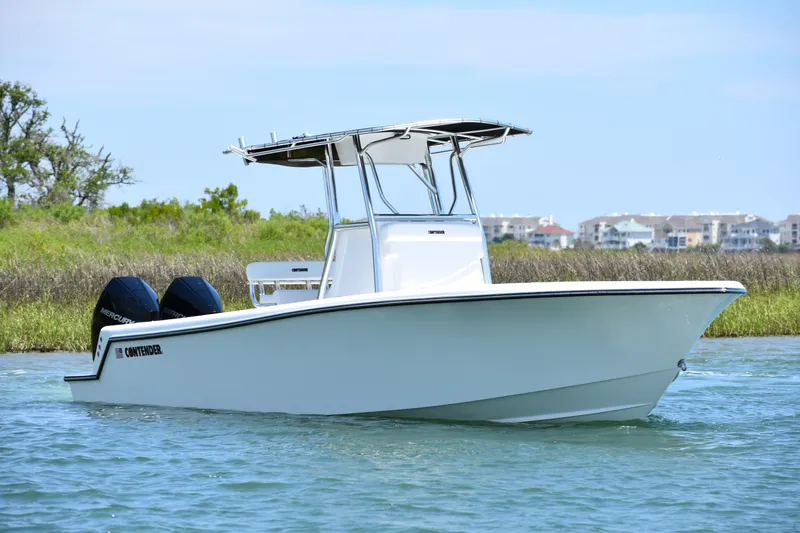  Yacht Photos Pics 2024 Contender 28 Tournament boat on water, featuring dual engines and sleek design.