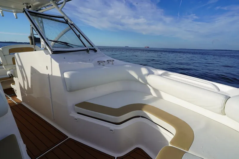  Yacht Photos Pics 2016 Edgewater 280 CX boat interior with seating, ocean view, and clear sky.
