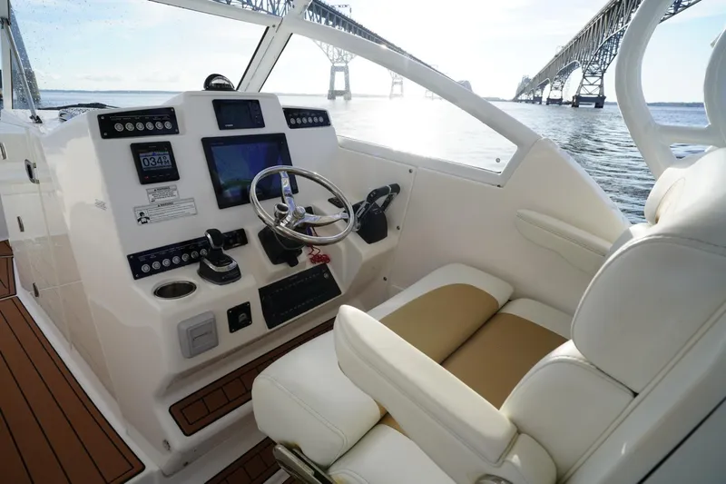 Yacht Photos Pics 2016 Edgewater 280 CX boat cockpit with modern controls and bridge view.
