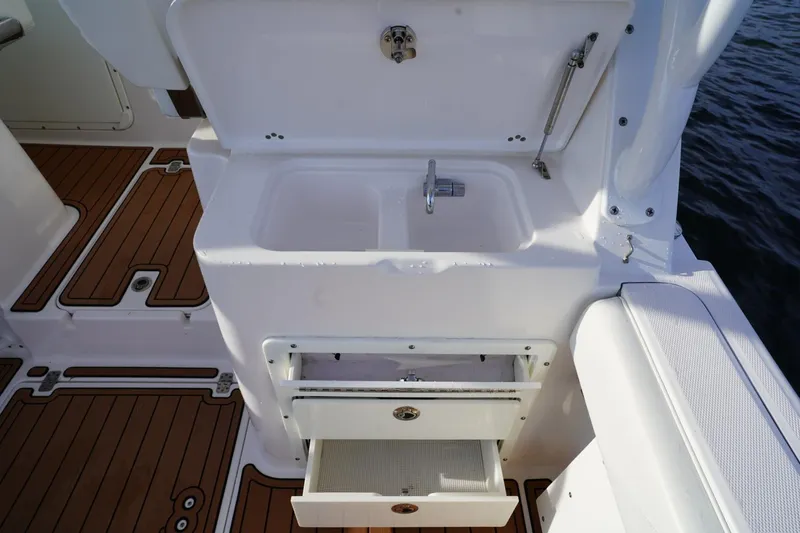  Yacht Photos Pics Edgewater 280 CX 2016 boat interior with sink and storage drawers.