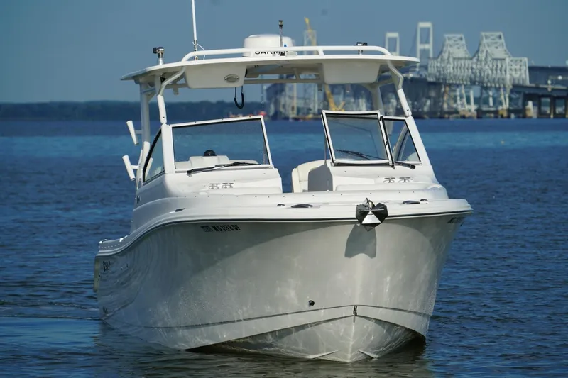  Yacht Photos Pics 2016 Edgewater 280 CX boat on water with bridge in background.