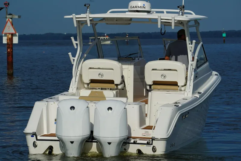  Yacht Photos Pics Edgewater 280 CX 2016 boat with dual engines on calm water.