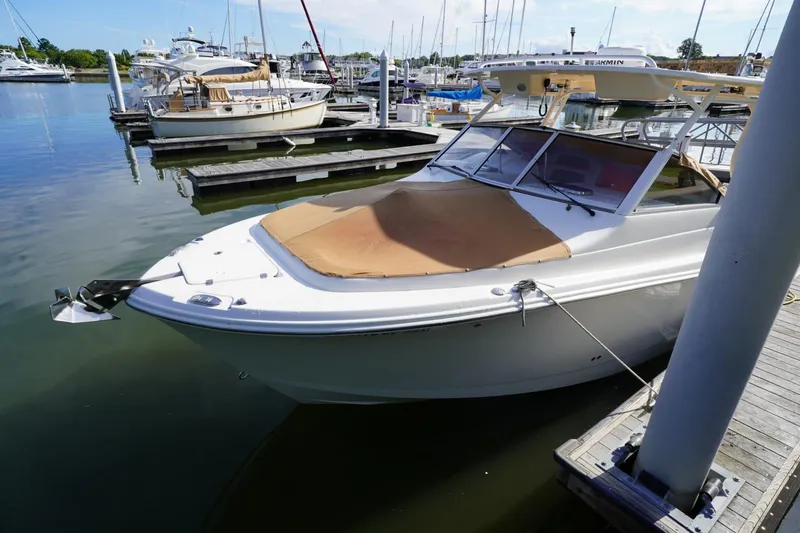  Yacht Photos Pics 2016 Edgewater 280 CX boat docked at a marina, featuring a covered bow.