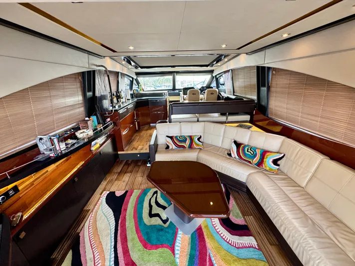 For Whom The Bell Tolls Yacht Photos Pics Luxurious interior of 2017 Sea Ray L590 yacht with modern furnishings and vibrant decor.