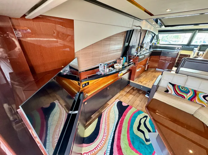 For Whom The Bell Tolls Yacht Photos Pics Luxurious interior of 2017 Sea Ray L590 yacht with modern design and vibrant decor.