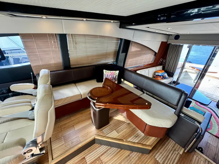 For Whom The Bell Tolls Yacht Photos Pics Luxurious interior of 2017 Sea Ray L590 yacht with elegant seating and wooden accents.