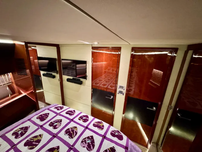 For Whom The Bell Tolls Yacht Photos Pics Luxurious cabin interior of 2017 Sea Ray L590 yacht with elegant wood finishes.