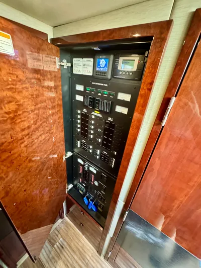For Whom The Bell Tolls Yacht Photos Pics Electrical panel inside 2017 Sea Ray L590 yacht, featuring control switches and displays.