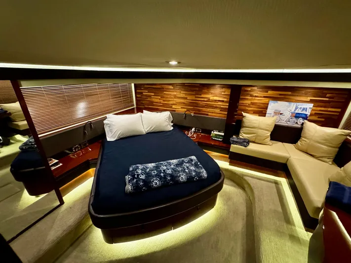 For Whom The Bell Tolls Yacht Photos Pics Luxurious 2017 Sea Ray L590 yacht cabin with elegant bedding and ambient lighting.