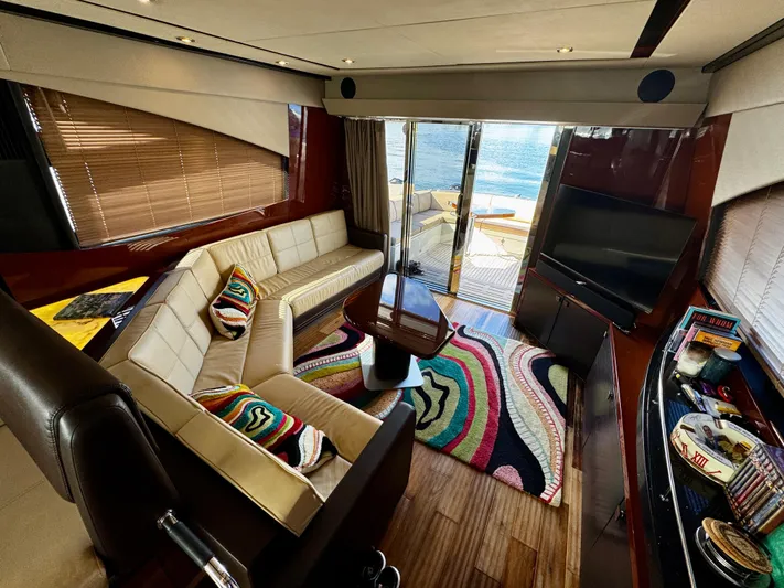 For Whom The Bell Tolls Yacht Photos Pics Luxurious interior of 2017 Sea Ray L590 yacht with modern decor and vibrant accents.