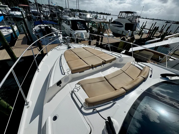 For Whom The Bell Tolls Yacht Photos Pics 2017 Sea Ray L590 yacht with sun loungers docked at marina.