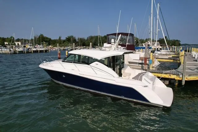  Yacht Photos Pics 2022 Tiara Yachts C39 Coupe docked at a marina, showcasing sleek design and modern features.