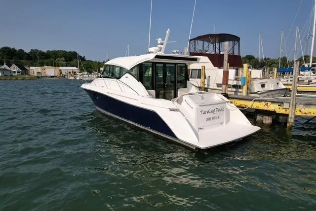  Yacht Photos Pics 2022 Tiara Yachts C39 Coupe docked in a marina, sunny day.