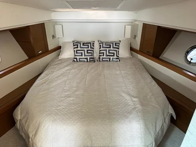  Yacht Photos Pics 2022 Tiara Yachts C39 Coupe cabin with a cozy bed and stylish decor.