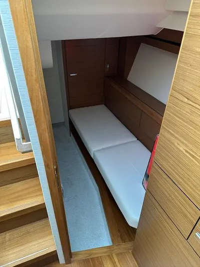  Yacht Photos Pics 2022 Tiara Yachts C39 Coupe interior cabin with wooden finish and white seating.