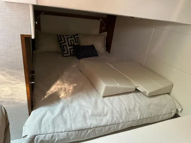  Yacht Photos Pics 2022 Tiara Yachts C39 Coupe cabin with bed and decorative pillows.