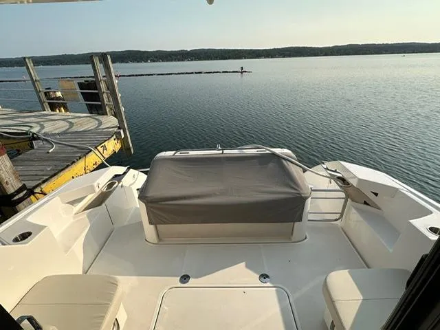  Yacht Photos Pics 2022 Tiara Yachts C39 Coupe docked, showcasing spacious deck and serene waterfront view.