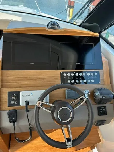  Yacht Photos Pics 2022 Tiara Yachts C39 Coupe helm with Garmin navigation and control systems.