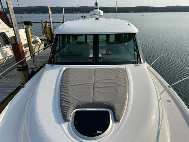  Yacht Photos Pics 2022 Tiara Yachts C39 Coupe docked, showcasing sleek design and spacious deck.