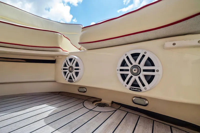 Capri Yacht Photos Pics 2008 Hinckley Talaria 38R Convertible interior with speakers and cushioned seating.