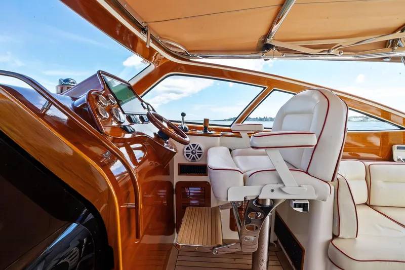 Capri Yacht Photos Pics Interior of 2008 Hinckley Talaria 38R Convertible yacht with luxurious helm and seating.