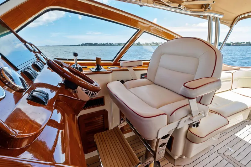 Capri Yacht Photos Pics Luxurious helm of 2008 Hinckley Talaria 38R Convertible yacht with leather seating.