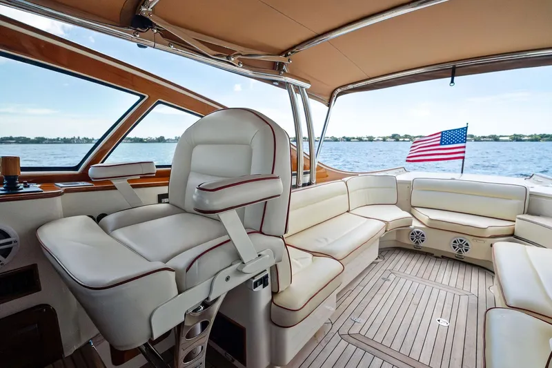 Capri Yacht Photos Pics Luxurious interior of 2008 Hinckley Talaria 38R Convertible yacht with American flag.