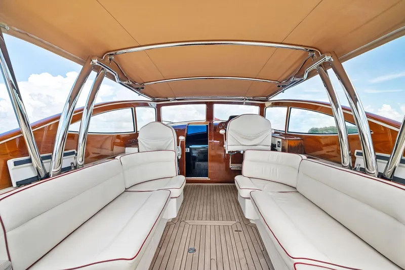 Capri Yacht Photos Pics Luxurious interior of 2008 Hinckley Talaria 38R Convertible yacht with elegant seating.