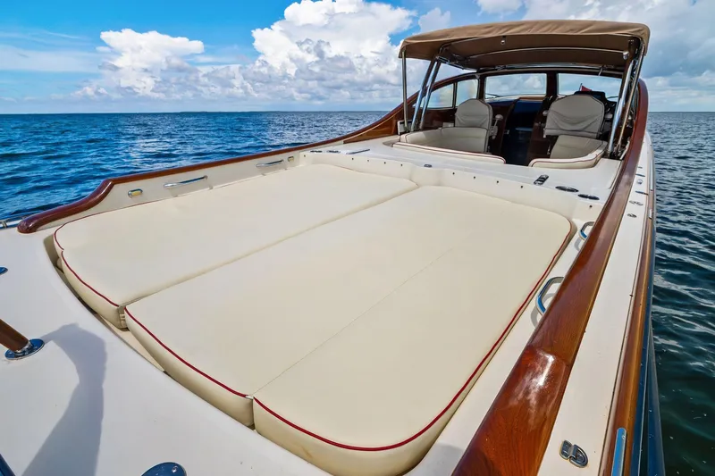 Capri Yacht Photos Pics 2008 Hinckley Talaria 38R Convertible yacht with spacious deck and luxurious seating on open water.