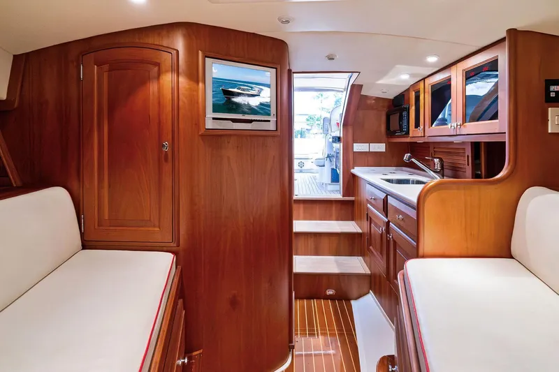 Capri Yacht Photos Pics Interior of 2008 Hinckley Talaria 38R Convertible yacht with wood finish and modern amenities.