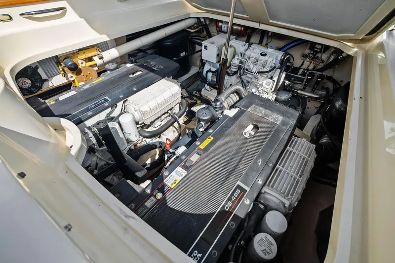 Capri Yacht Photos Pics Engine compartment of 2008 Hinckley Talaria 38R Convertible, showcasing dual engines and mechanical components.