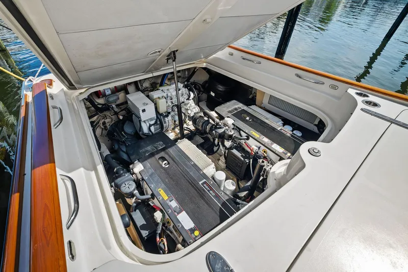 Capri Yacht Photos Pics Engine compartment of a 2008 Hinckley Talaria 38R Convertible boat, showcasing detailed machinery.