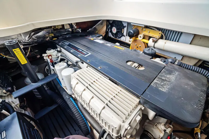 Capri Yacht Photos Pics Engine compartment of a 2008 Hinckley Talaria 38R Convertible boat, showcasing mechanical components.