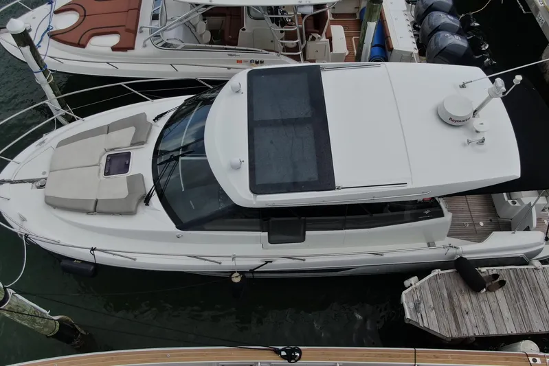 Andalucia Yacht Photos Pics 2017 Jeanneau NC 11 boat docked, aerial view showing sleek design and spacious deck.