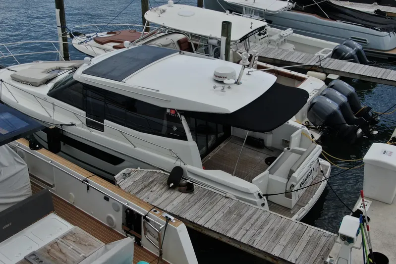 Andalucia Yacht Photos Pics 2017 Jeanneau NC 11 yacht docked at marina, featuring sleek design and modern amenities.