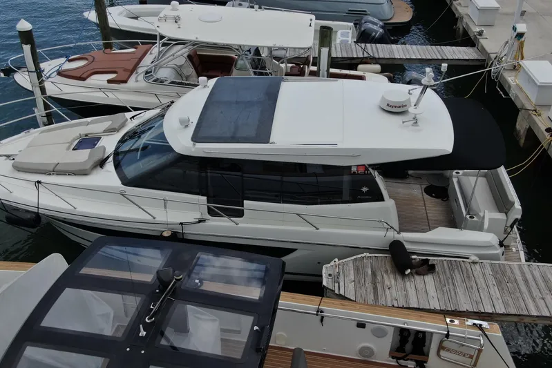Andalucia Yacht Photos Pics 2017 Jeanneau NC 11 yacht docked at marina, aerial view.