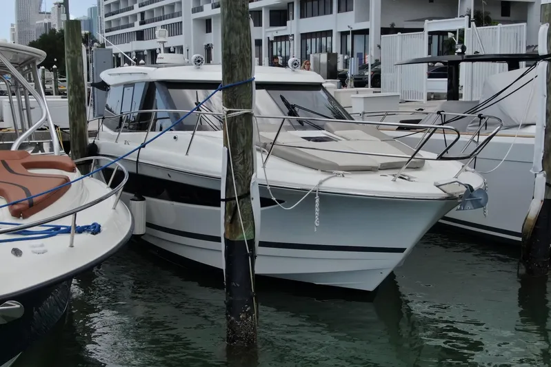 Andalucia Yacht Photos Pics 2017 Jeanneau NC 11 yacht docked at marina, surrounded by other boats.