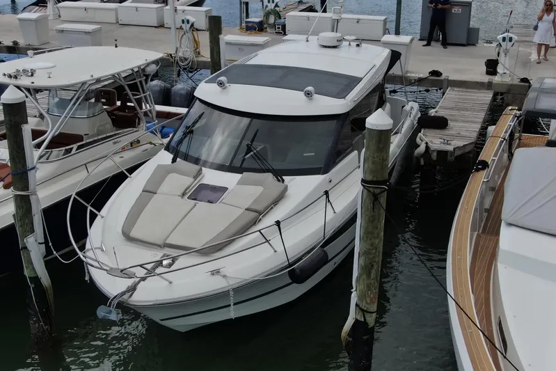 Andalucia Yacht Photos Pics 2017 Jeanneau NC 11 yacht docked at marina with adjacent boats.