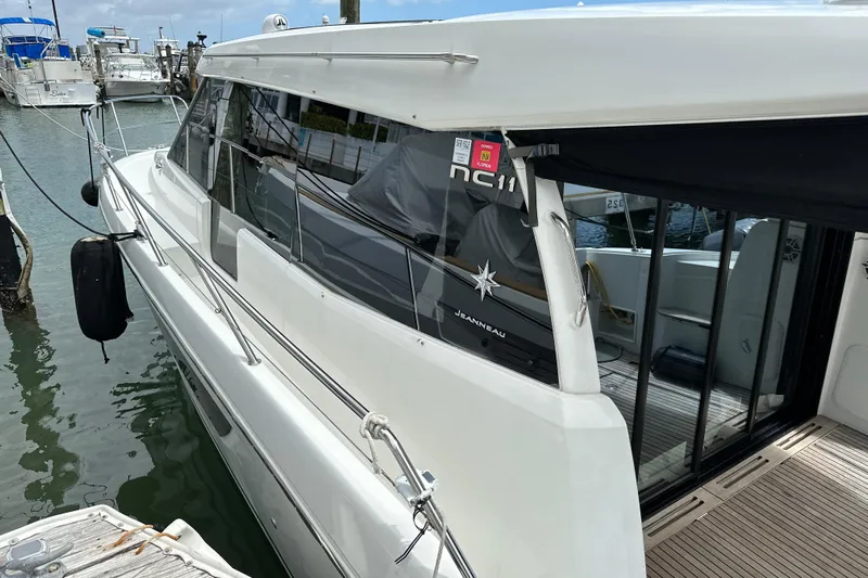 Andalucia Yacht Photos Pics 2017 Jeanneau NC 11 yacht docked at marina, side view.