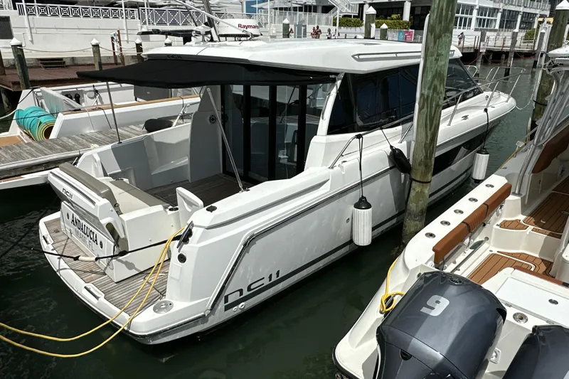 Andalucia Yacht Photos Pics 2017 Jeanneau NC 11 yacht docked at marina, featuring sleek design and modern amenities.