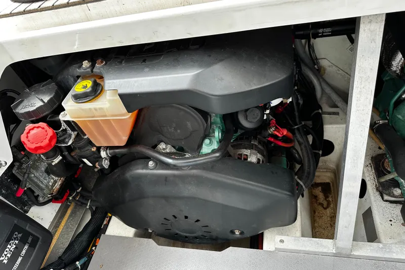 Andalucia Yacht Photos Pics Engine compartment of a 2017 Jeanneau NC 11 boat, showcasing mechanical components.