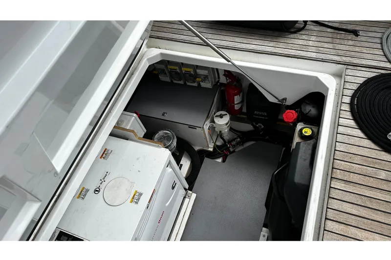 Andalucia Yacht Photos Pics Engine compartment of 2017 Jeanneau NC 11 boat with equipment and fire extinguisher.